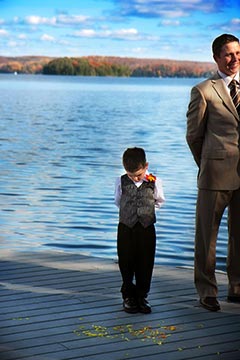 Northern Ontario Wedding Photography - Ringbearer near lake looking down