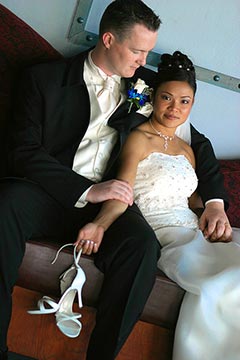 Toronto Wedding Photography - Bride and Groom resting holding heels